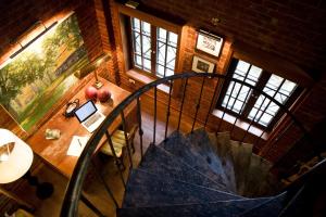 an overhead view of a wooden table with an umbrella at Kaomai Lanna Resort in San Pa Tong