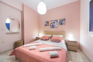 Postel nebo postele na pokoji v ubytování Omega Comfy Apartments