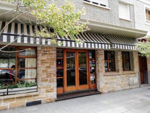 a store front with glass doors on a building at Hotel Arcos in Mar del Plata