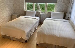 Letto o letti in una camera di American Village Resort