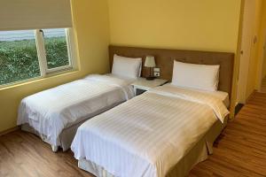 Letto o letti in una camera di American Village Resort