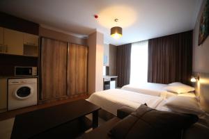 A bed or beds in a room at Hotel Soft