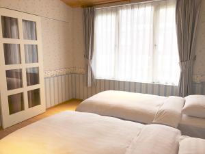 Letto o letti in una camera di American Village Resort