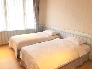 Letto o letti in una camera di American Village Resort