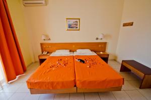 Postel nebo postele na pokoji v ubytování Stella Hotel