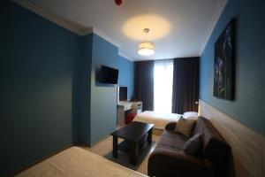 A bed or beds in a room at Hotel Soft