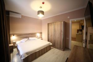 A bed or beds in a room at Hotel Soft