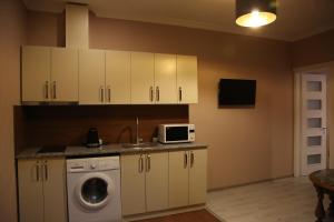 A kitchen or kitchenette at Hotel Soft