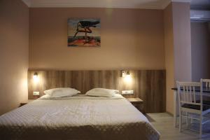 A bed or beds in a room at Hotel Soft