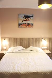 A bed or beds in a room at Hotel Soft