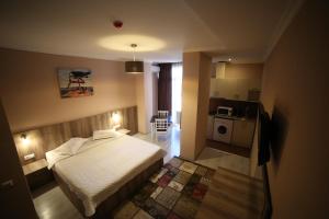 A bed or beds in a room at Hotel Soft