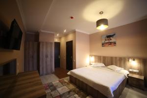 A bed or beds in a room at Hotel Soft