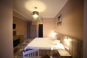 A bed or beds in a room at Hotel Soft