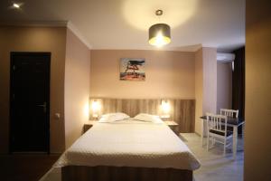 A bed or beds in a room at Hotel Soft