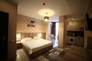 Kuchyň nebo kuchyňský kout v ubytování Hotel Soft
