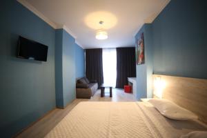 A bed or beds in a room at Hotel Soft