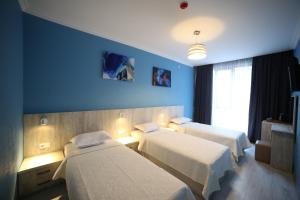 A bed or beds in a room at Hotel Soft
