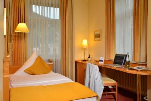Voodi või voodid majutusasutuse City Partner Hotel Holländer Hof toas