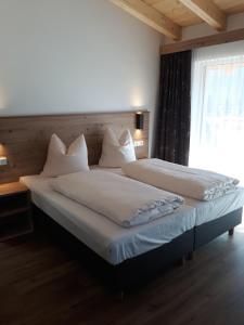 Krevet ili kreveti u jedinici u okviru objekta Hotel Jagdhof