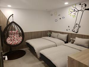 Postel nebo postele na pokoji v ubytování Chingya House