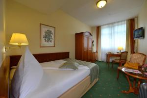 Voodi või voodid majutusasutuse City Partner Hotel Holländer Hof toas