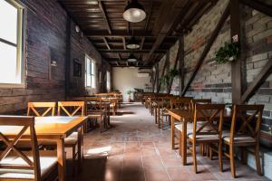 an empty restaurant with wooden tables and chairs at Yushow Library Villa in Nanzhuang