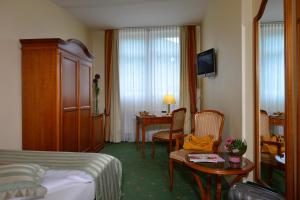 TV a/nebo společenská místnost v ubytování City Partner Hotel Holländer Hof