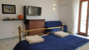 TV a/nebo společenská místnost v ubytování Filù Rooms Paradise Tower