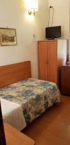 Postel nebo postele na pokoji v ubytování Hotel Tirreno