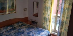 Postel nebo postele na pokoji v ubytování Hotel Tirreno