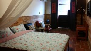 Ένα ή περισσότερα κρεβάτια σε δωμάτιο στο Pearl B&B