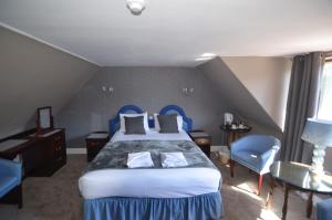 Postel nebo postele na pokoji v ubytování Achilty Guest House