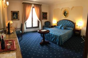 Postel nebo postele na pokoji v ubytování Grand Hotel Palace