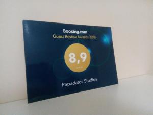 a sign on the wall of a class reviewadobeadobeadobe sockets at Papadatos Studios in Argostoli