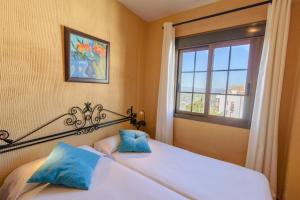 Postel nebo postele na pokoji v ubytování Hotel Rural Sierra Tejeda