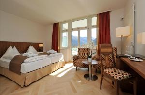 Postel nebo postele na pokoji v ubytování Waldhotel & SPA Davos - for body & soul