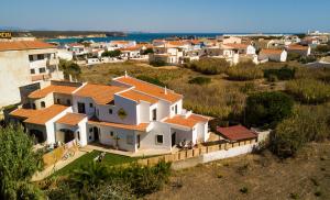 an aerial view of a villa in a village at Algarve Surf Hostel - Sagres in Sagres