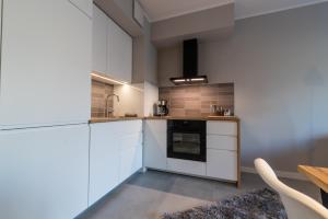 Kuchnia lub aneks kuchenny w obiekcie City Lights Rakowicka 15