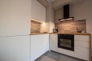 Kuchnia lub aneks kuchenny w obiekcie City Lights Rakowicka 15