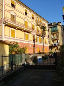 a large building with a fence in front of it at CASA DIPINTA in Rapallo