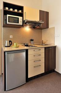 Kuchyň nebo kuchyňský kout v ubytování Melrose Apartments