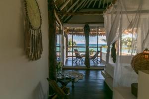 a view from a balcony of a house with a view of the ocean at Alma Tulum Hotel Boutique in Tulum