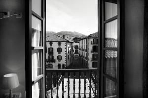 a view of a city from a window at Hostal Trinkete Antxitonea in Elizondo
