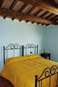 Voodi või voodid majutusasutuse Il vecchio seccatoio toas