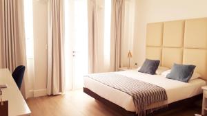 Cama ou camas em um quarto em Casa Paracas