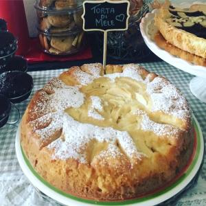 a cake on a plate on a table at Mille Soli Bed and Breakfast in Buggerru