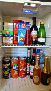 a refrigerator filled with lots of food and drinks at Hotel Bologna in Florence