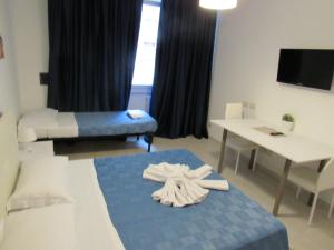 a hospital room with a bed and a table at PIANETA ROMA 39 in Rome