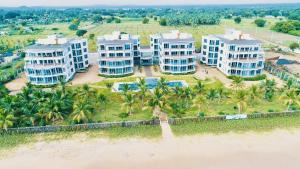 an aerial view of a resort on the beach at 123 Ocean Front Condo in Nilaveli