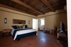 Katil atau katil-katil dalam bilik di AGRITURISMO CASCINA GRAZIOSA